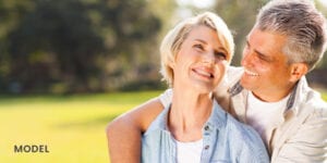 Older Couple Smiling and Looking at Each Other While Embracing