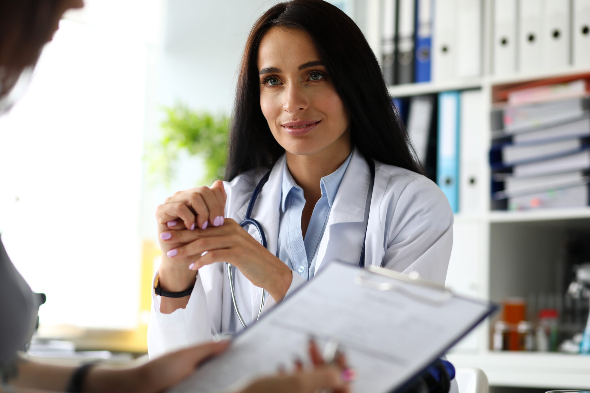 Female visitor filling out medicine documents